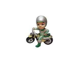 boy mac riding on motorcycle